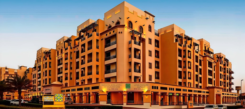 The Square by OMNIYAT, a modern building housing the apartment, showcasing contemporary architecture.