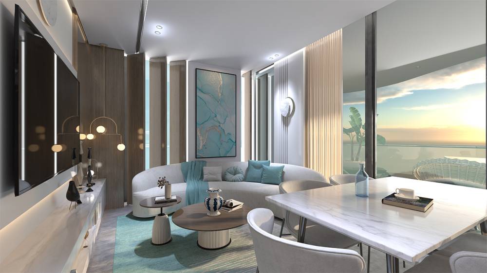 Contemporary living room with sleek white furniture and a large television, located in Samana Santorini.