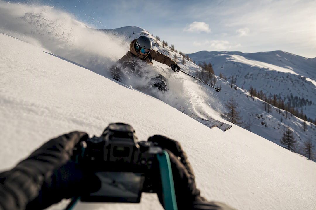 Skier making a turn through powder snow