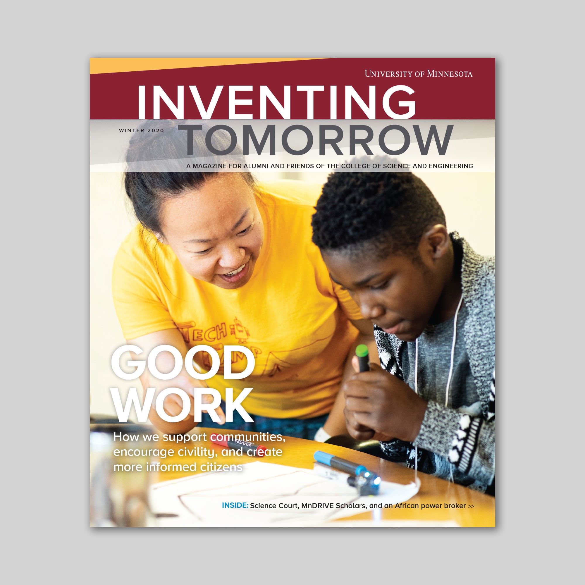 Magazine with a boy and woman on cover working with robots