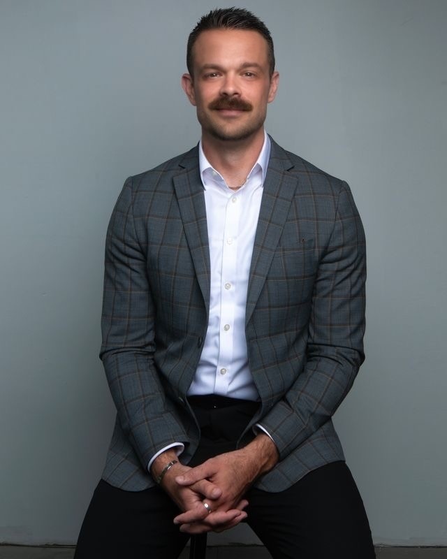 Mark Lunsford in a gray suit