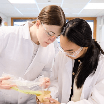 Ajsel Budlla and her friend conducting a science experiment