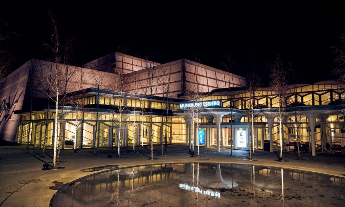 a building with trees and plants