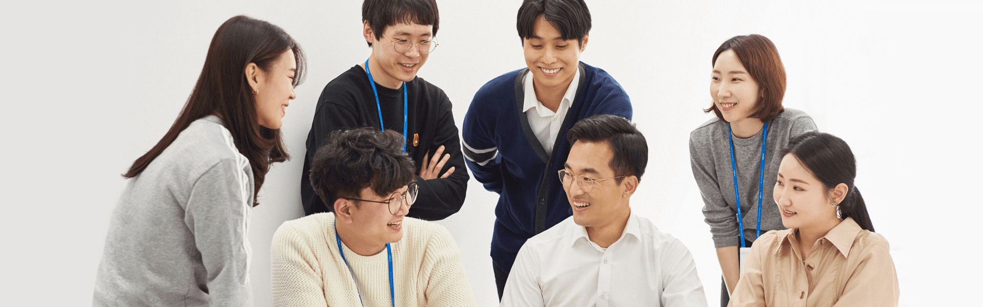 Group of diverse coworkers in a collaborative meeting, sharing ideas and smiling. Teamwork and professional concept.