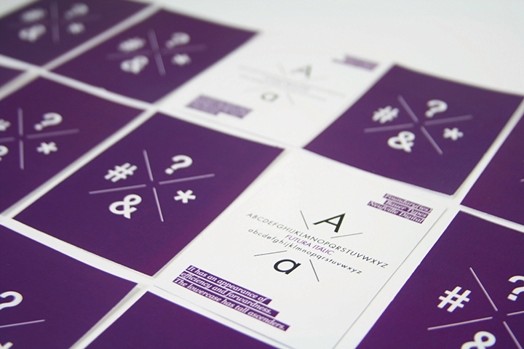 surprise cards with a purple back and two are turned over to reveal a white side and A letter with some text below it