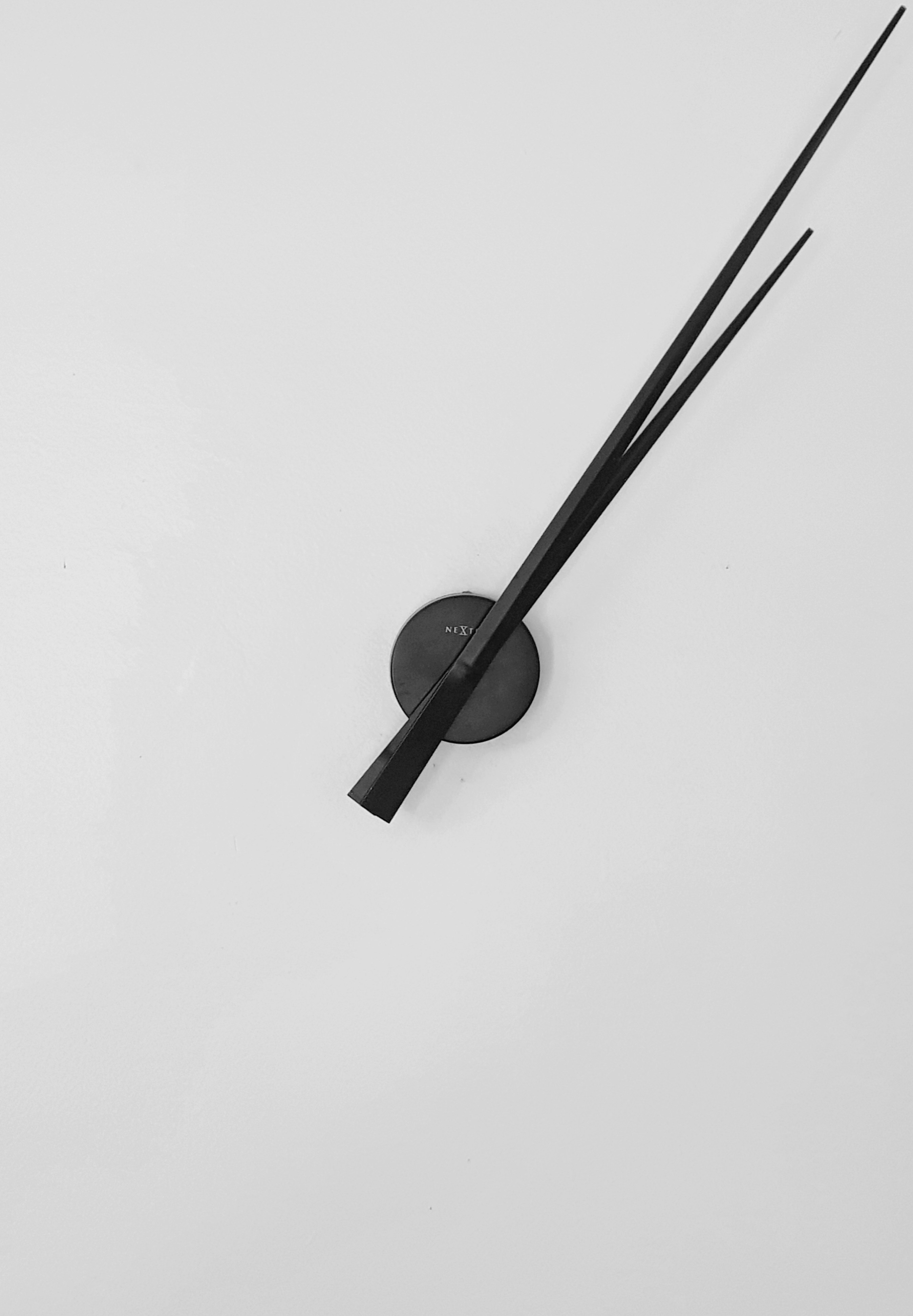 black round analog wall clock