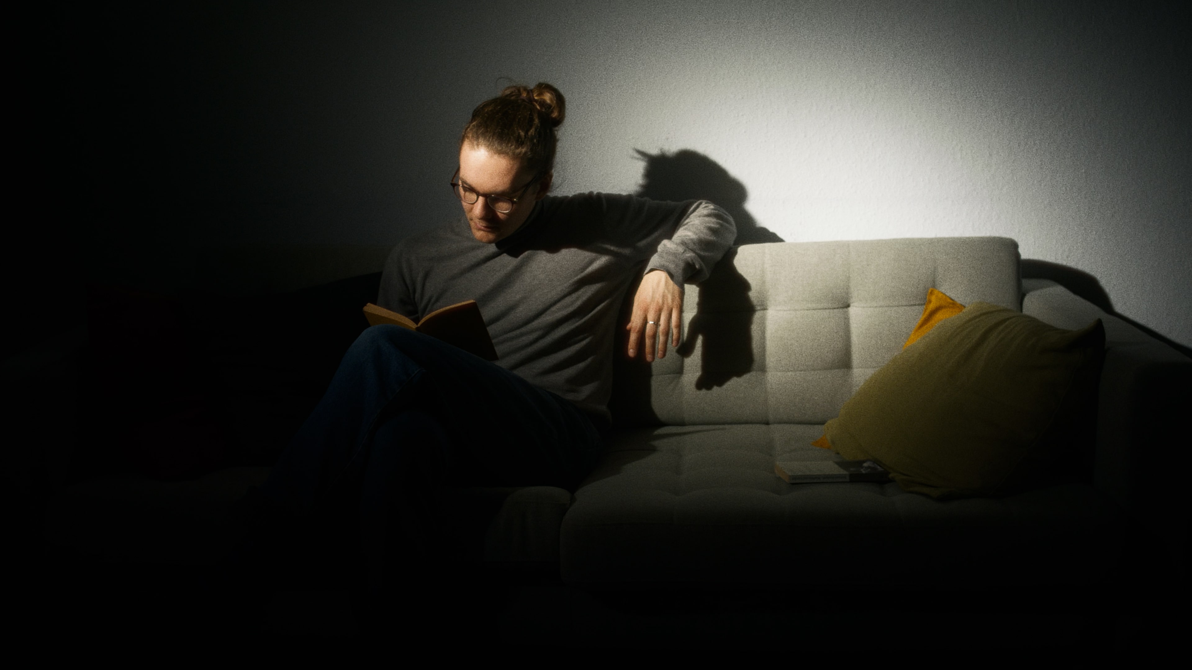 men sitting in a spotlight