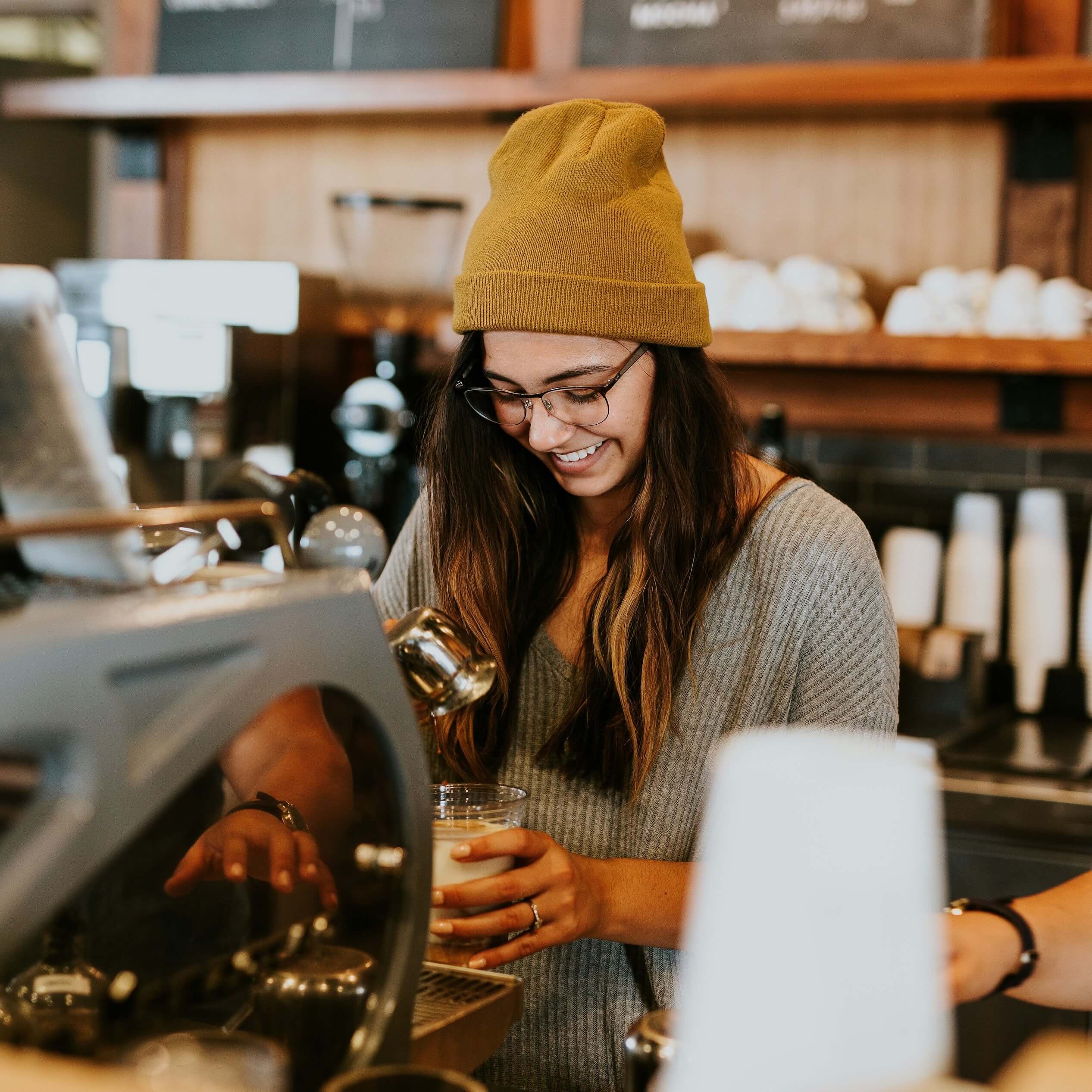 Barista preparing coffee in a Melbourne cafe.