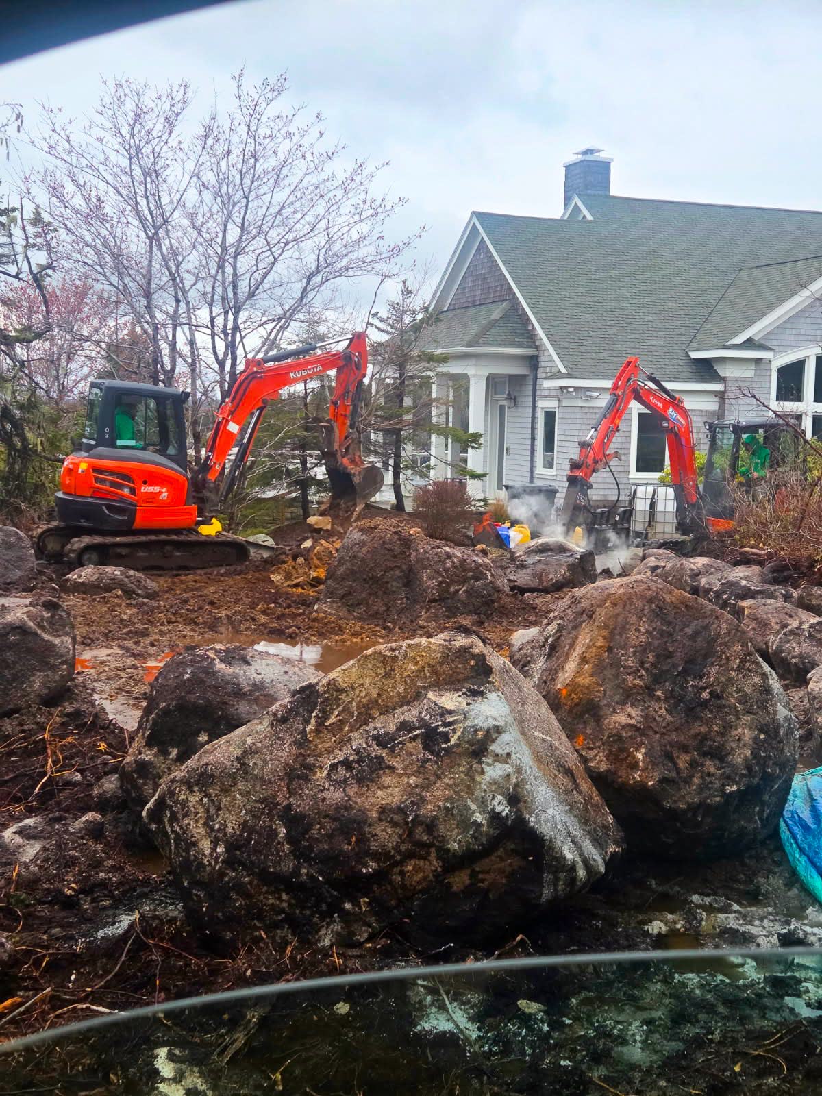 Two Doucet excavators working on a residential site in Halifax