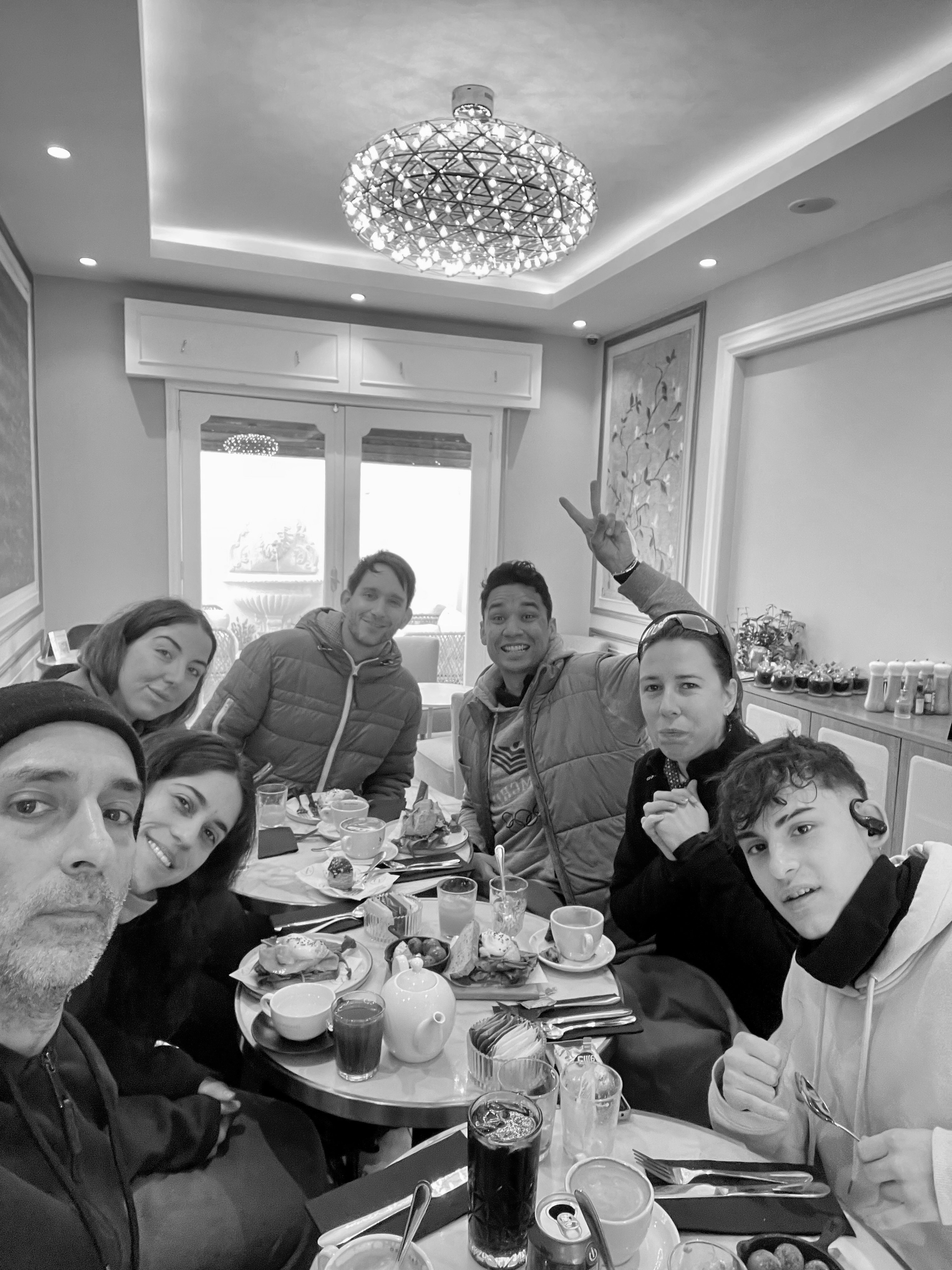 Interior of a cafe or workspace with several people at tables