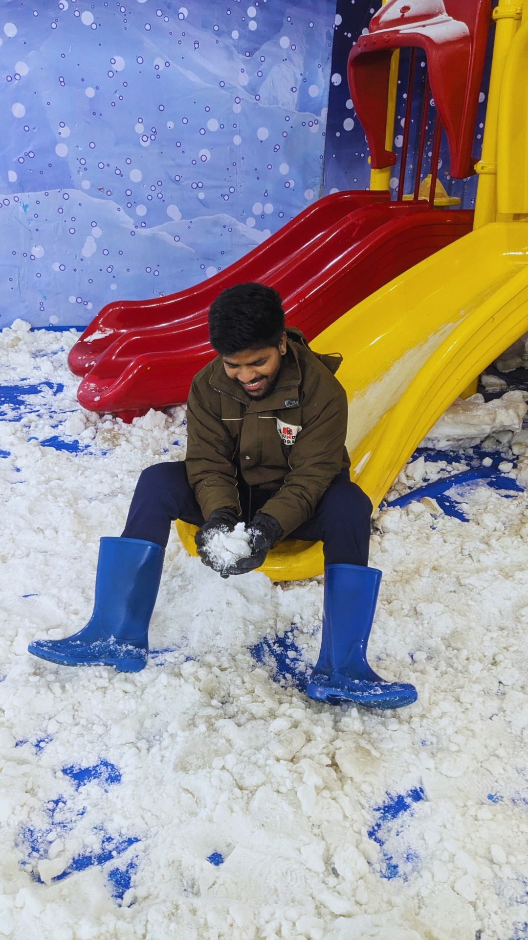 Person sitting on a ledge overlooking New York City skyline