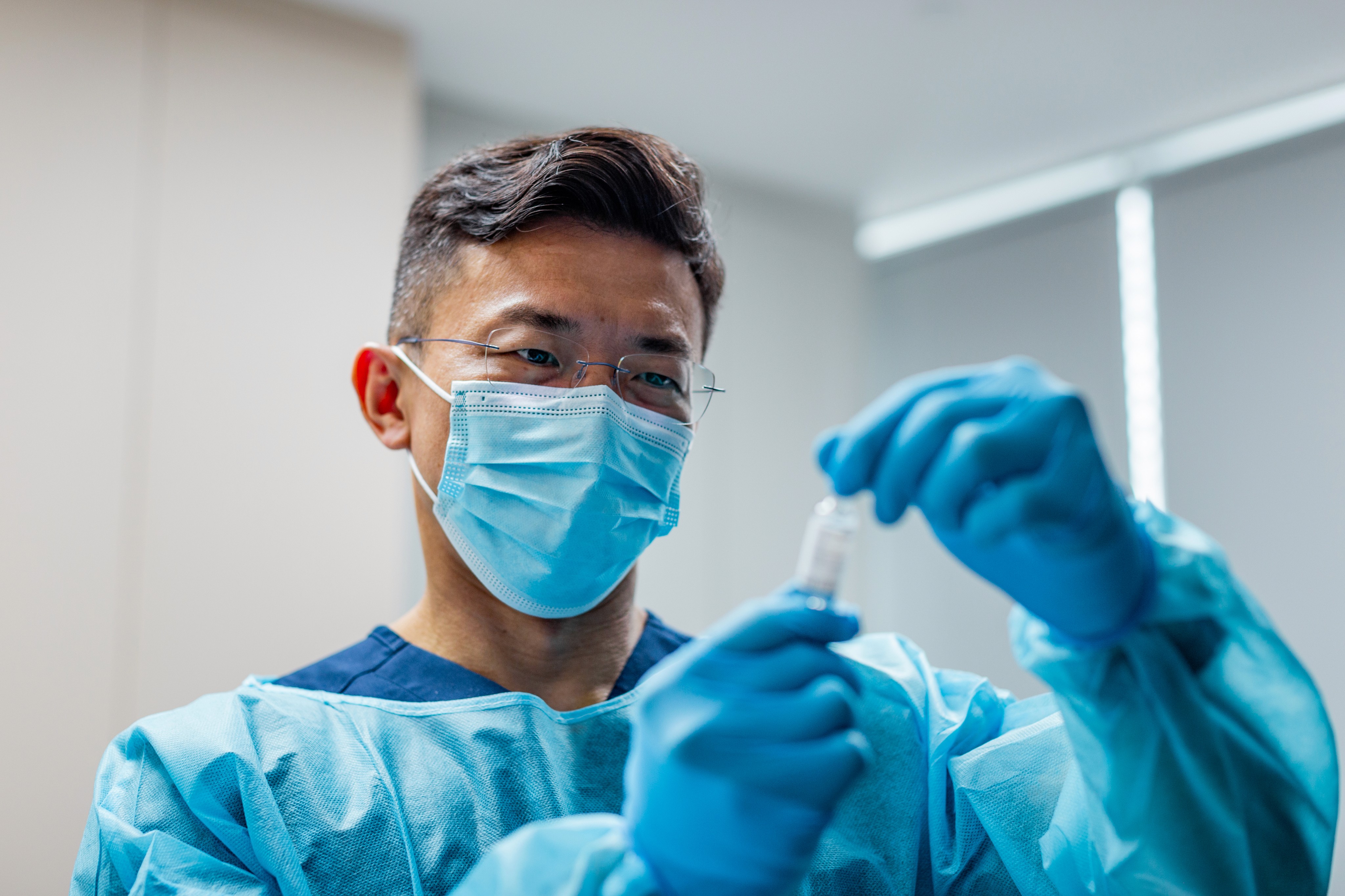 Dr Loong preparing medications.