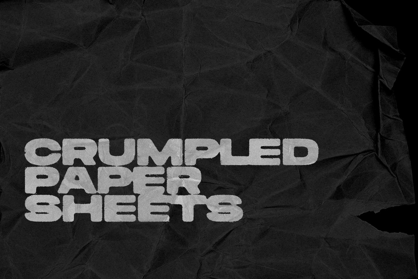 Black crumpled paper sheet texture featuring realistic deep folds and organic paper wrinkles