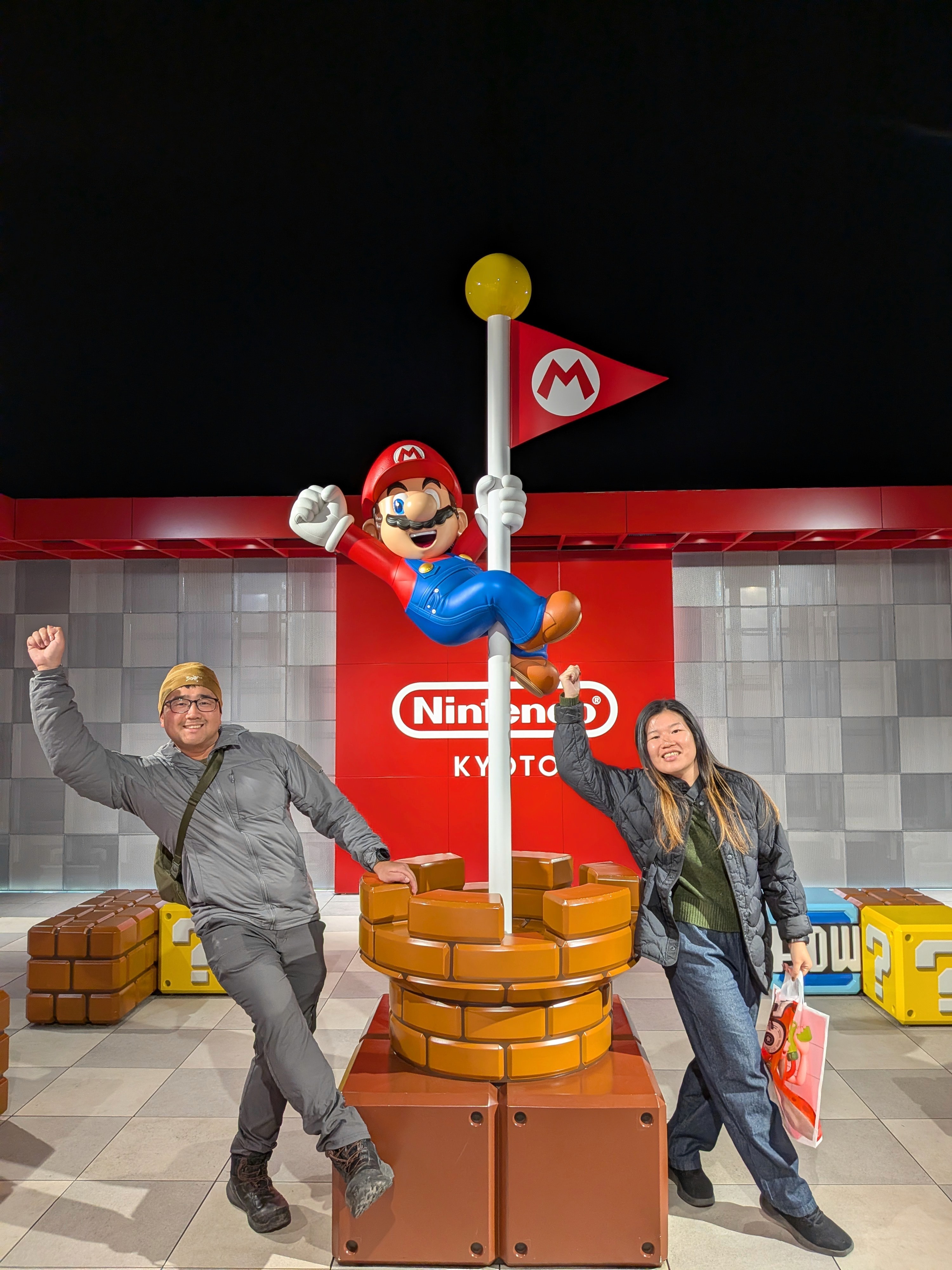 Close-up of two hands gently clasped, one wearing a sparkling engagement ring. The soft lighting and pastel nails evoke a sense of romance and intimacy.