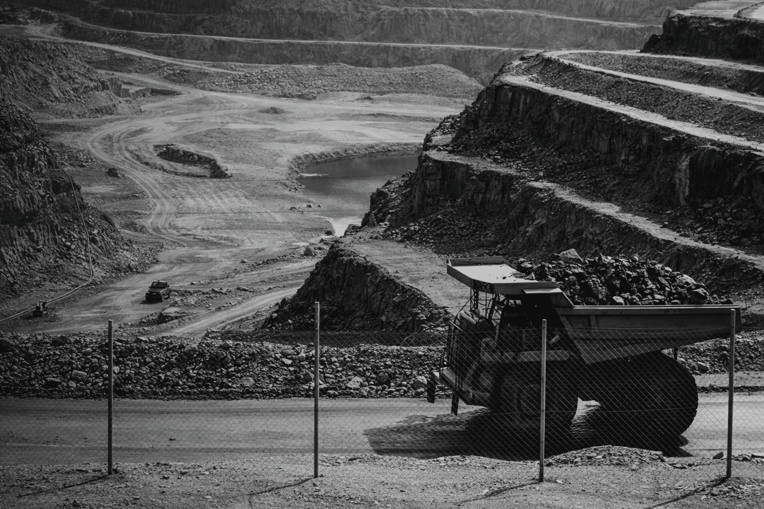 yellow and black truck on road near mountain during daytime