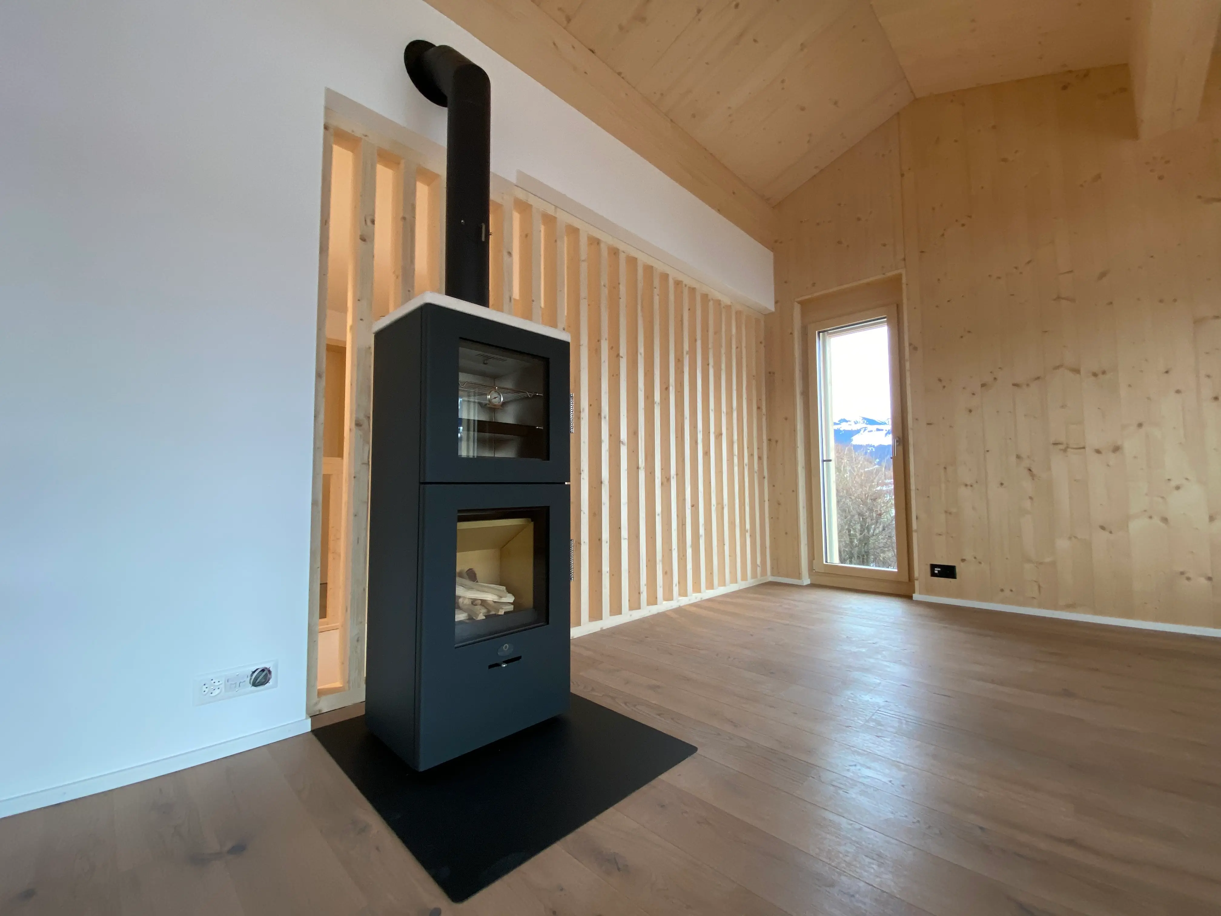 Kamin in Neubau in Fanas - Niggli Architektur Grüsch