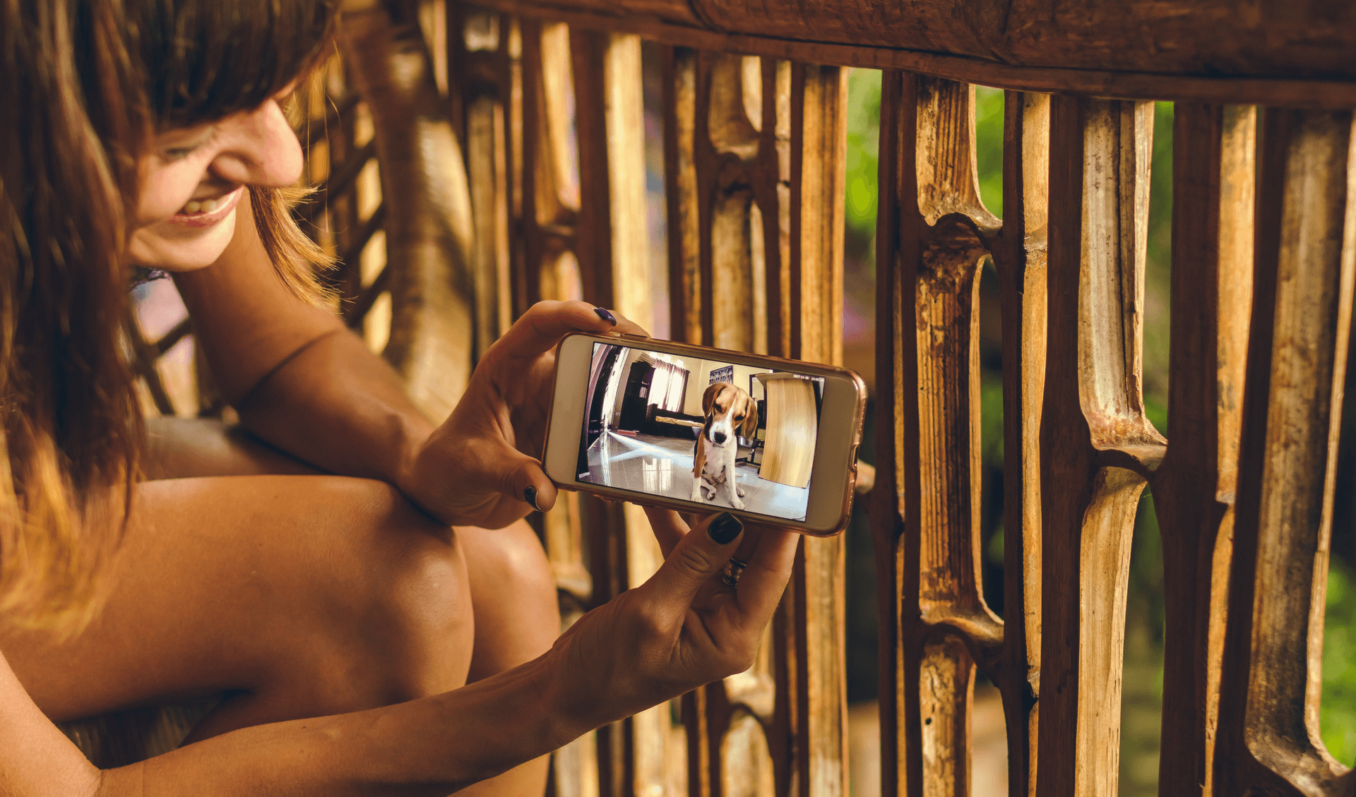 A woman showing a photo of her dog to a friend