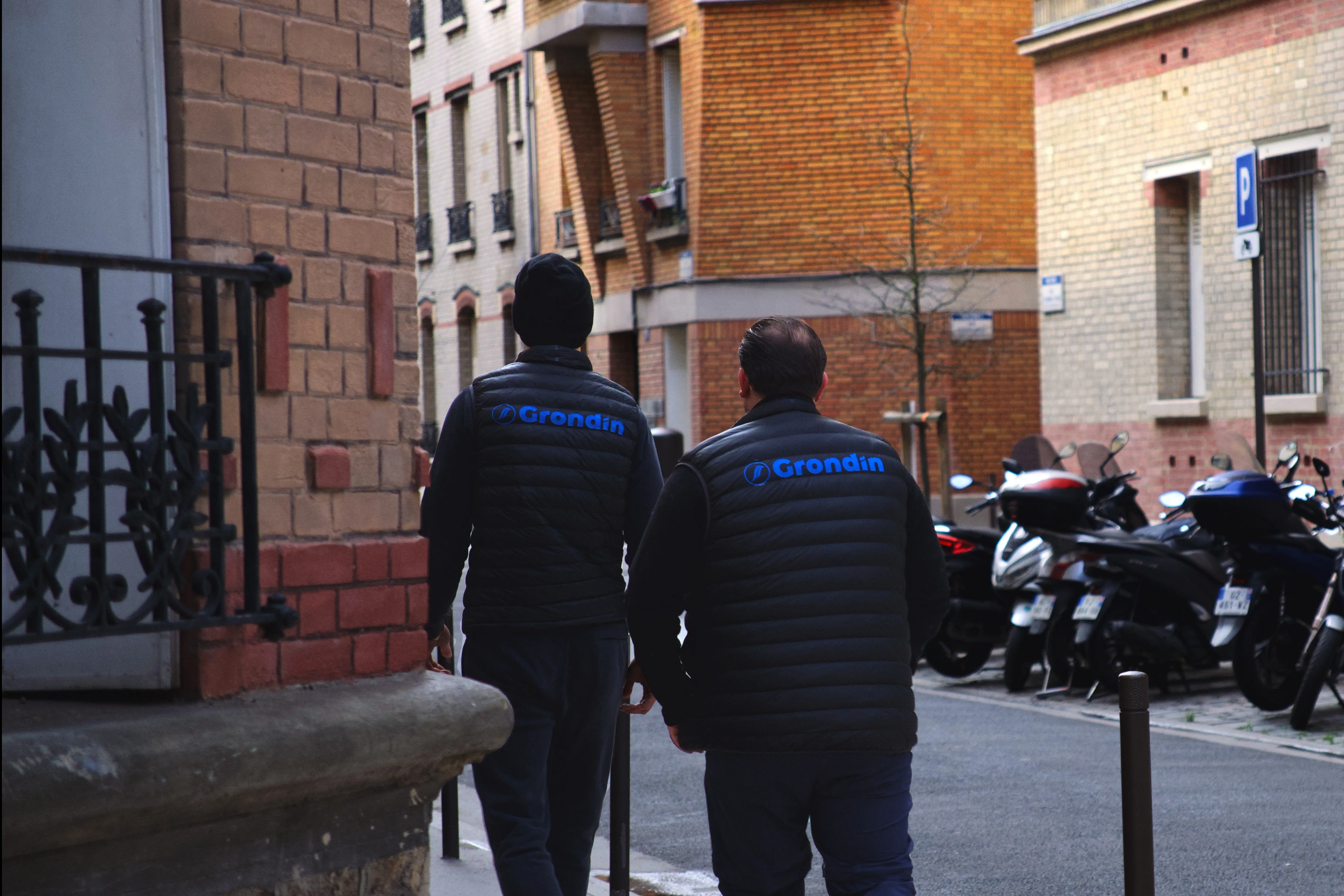 man in blue polo shirt sitting on chair