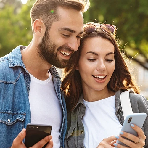 Young couple in love walking outdoors at the city street.