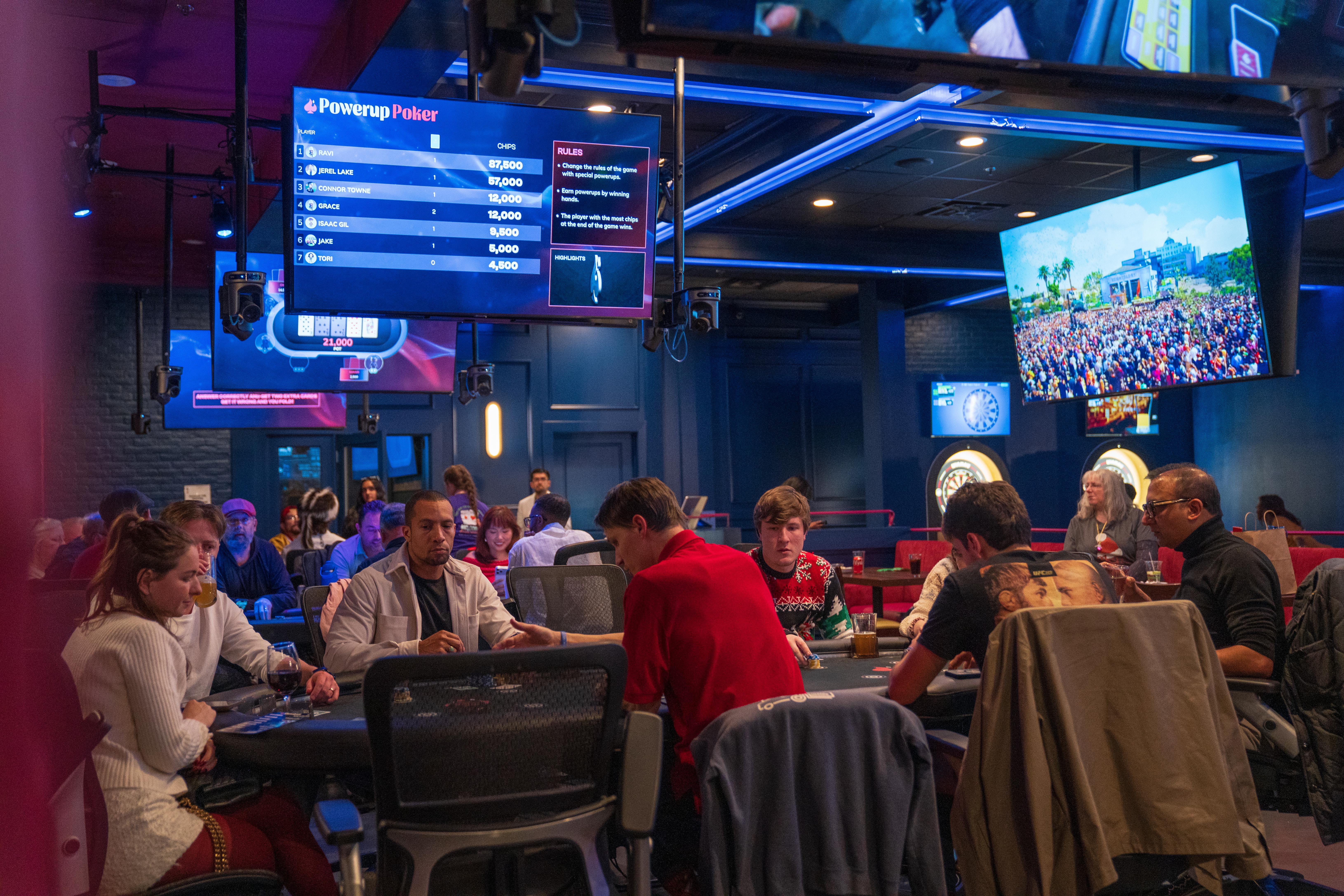 Large group event at Showdown Social with guests at gaming tables