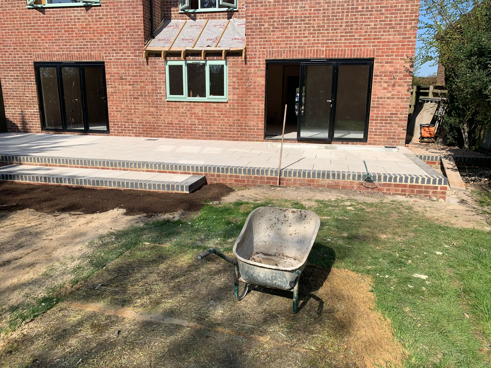 a tall building with scaffolding around the windows