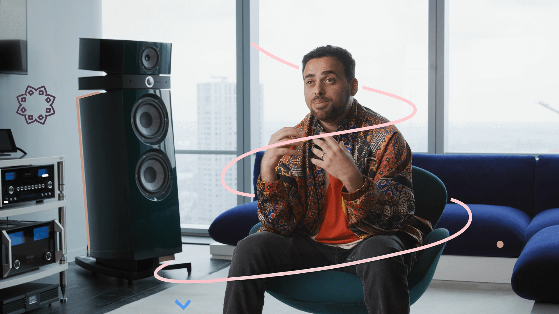 Interview subject speaking in studio surrounded by audio equipment with animated motion trails