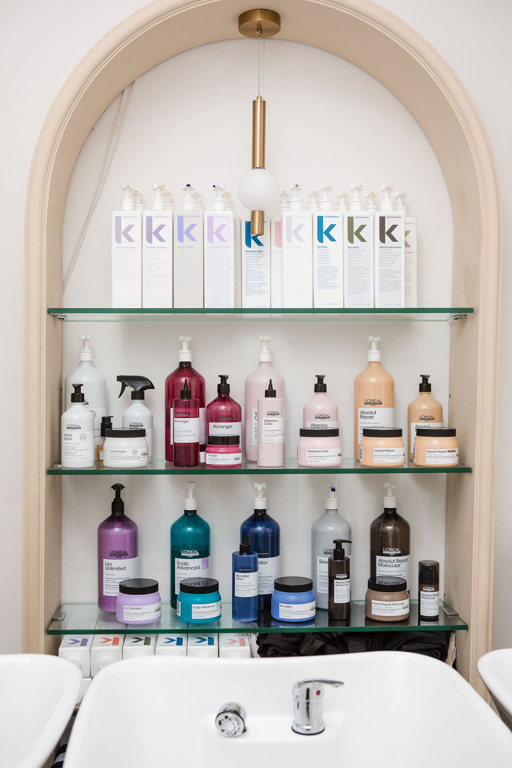 Professional haircare products display at Havie & Moon salon Dubai Hills featuring Kevin Murphy and L'Oréal ranges