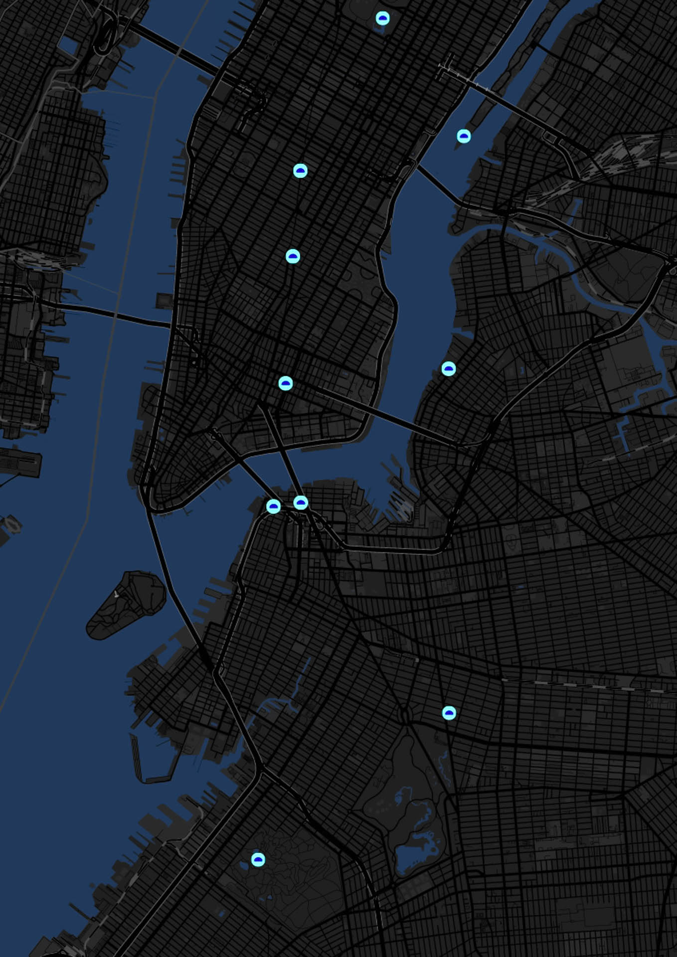 A dark map of New York City shows several light blue dots scattered across the grid of streets and waterways. The dots vary in size and are distributed across the map. A body of water is visible in the upper left portion of the map.