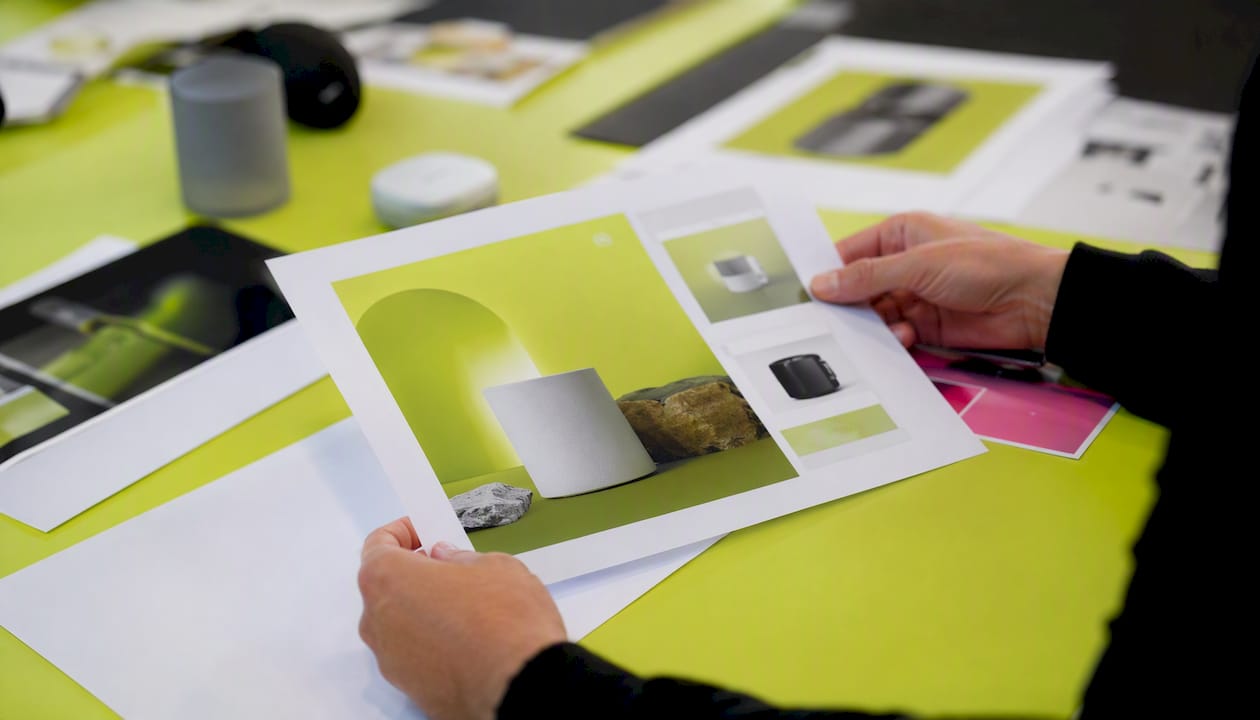 Hands holding product image for ad concept