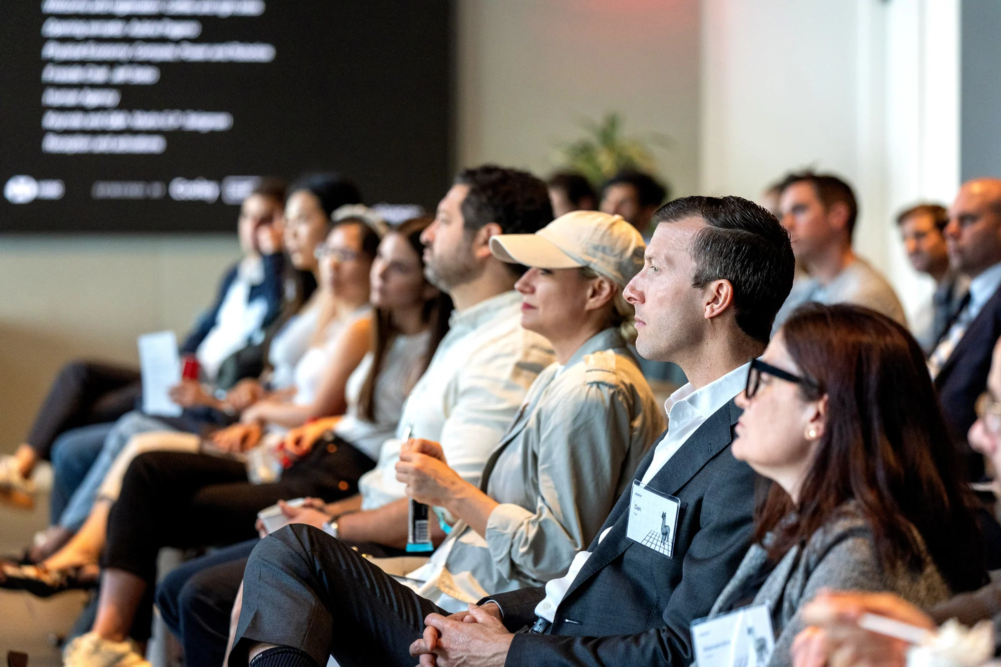 Guests listening in the event audience.