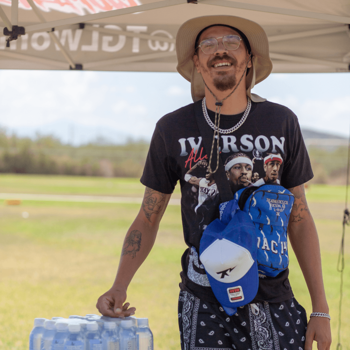 a man with a goatee smiles at the camera