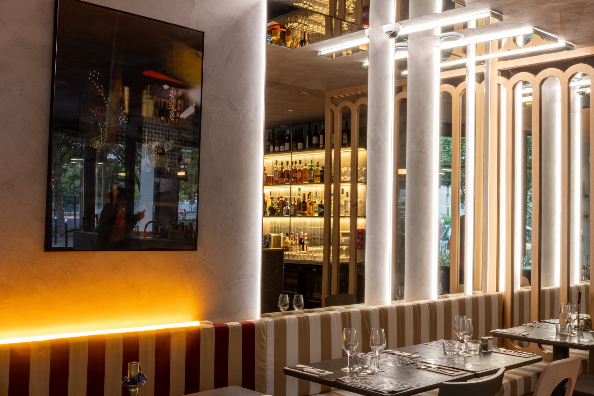 Sleek modern bathroom with concrete walls, floating sinks, and ambient lighting. Minimalist design with industrial elements.