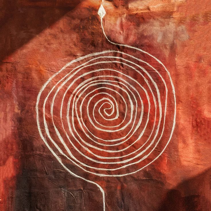 White spiral painted on red earth canvas, sacred earth symbol