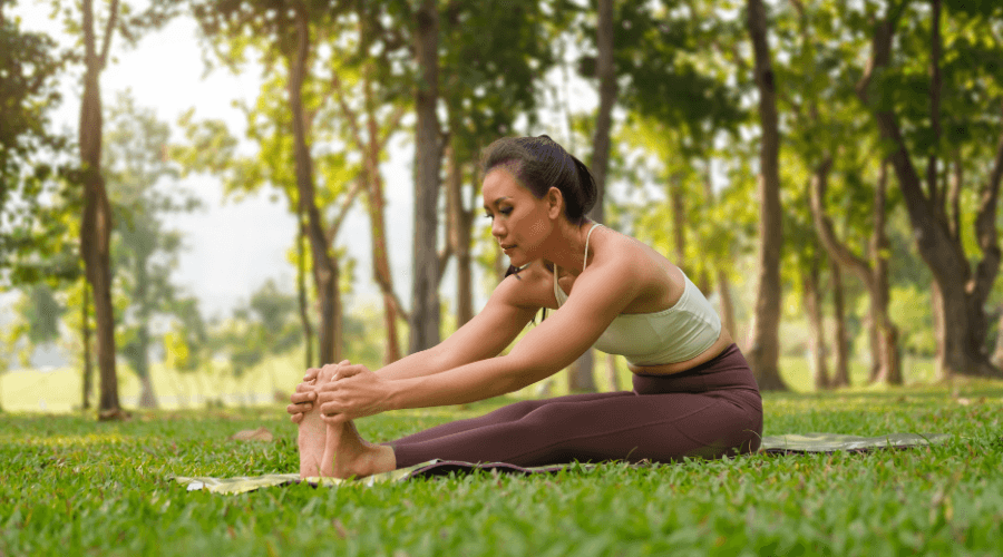 Woman doing yoga in a forest