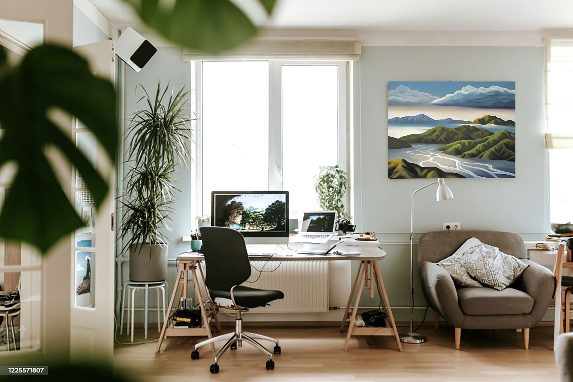 Converted home office with modern working space and living area.