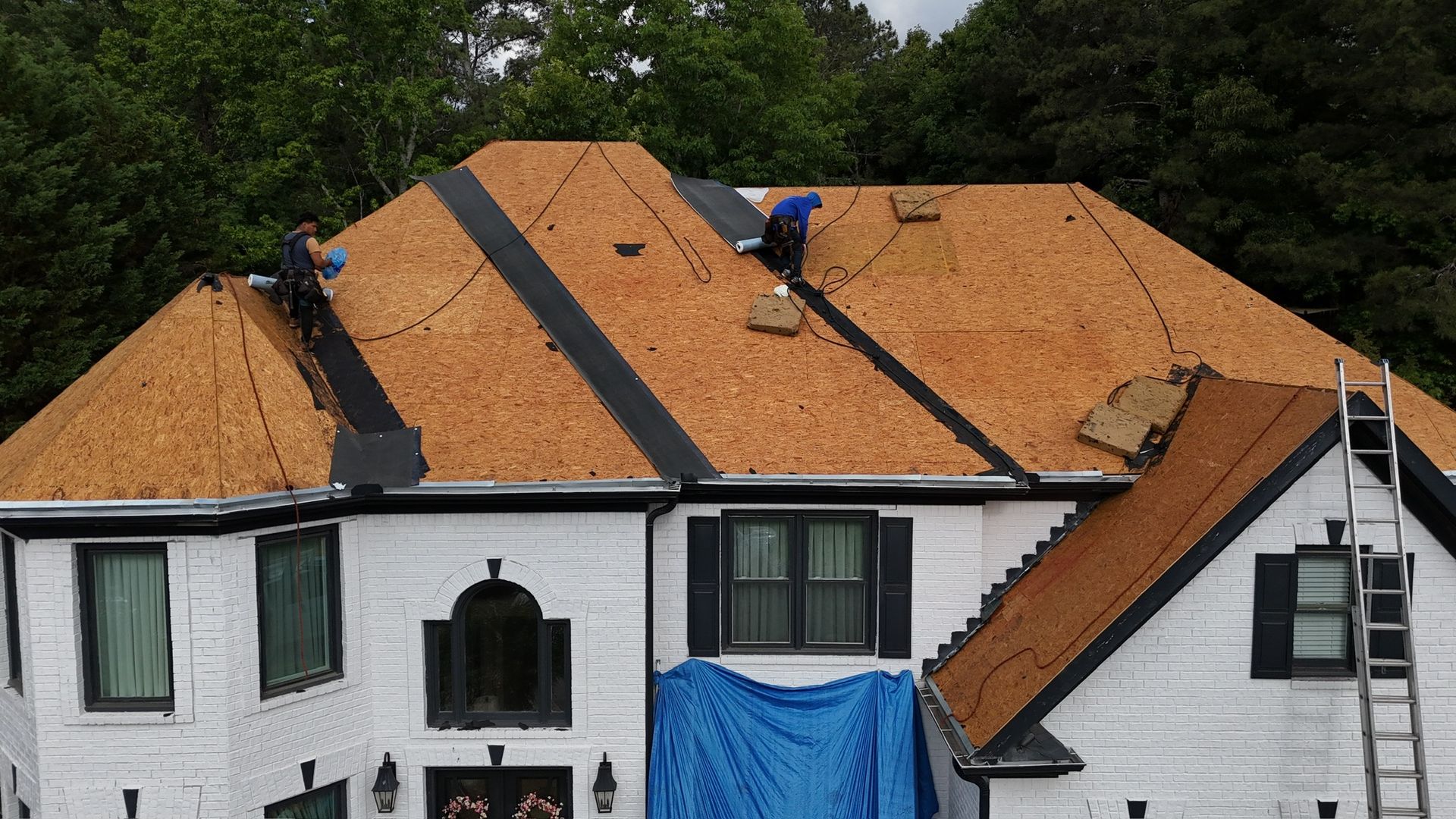 Roof decking exposed and checked during a roof replacement in Alpharetta, GA