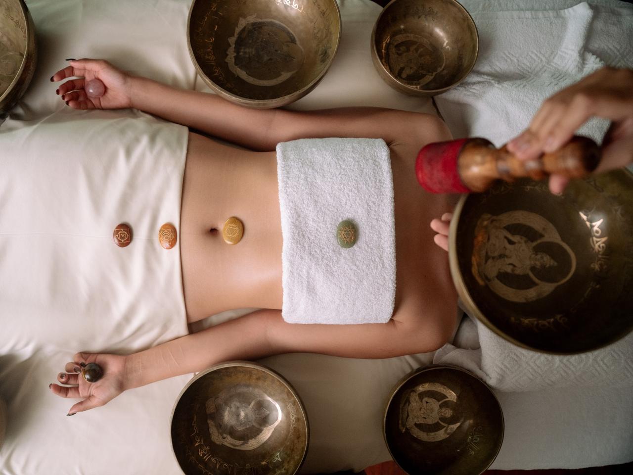 A person browsing a retreat website on a laptop in a cozy space, soft morning light, plant decor, clean modern aesthetic, sense of curiosity and exploration.