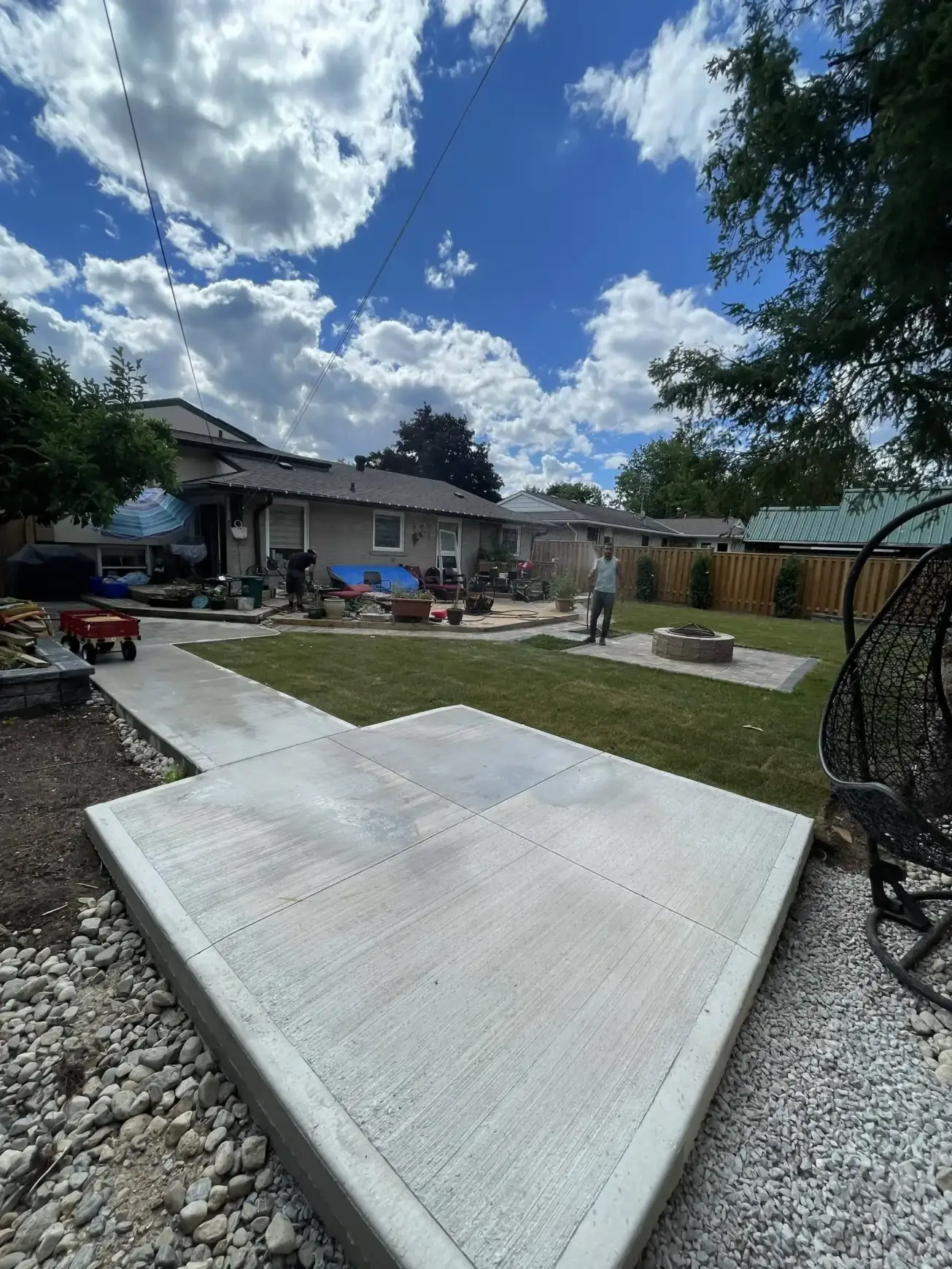 Finished concrete patio slab with clean edges by Falcons Landscaping.
