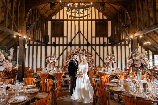 couple outside of the barn