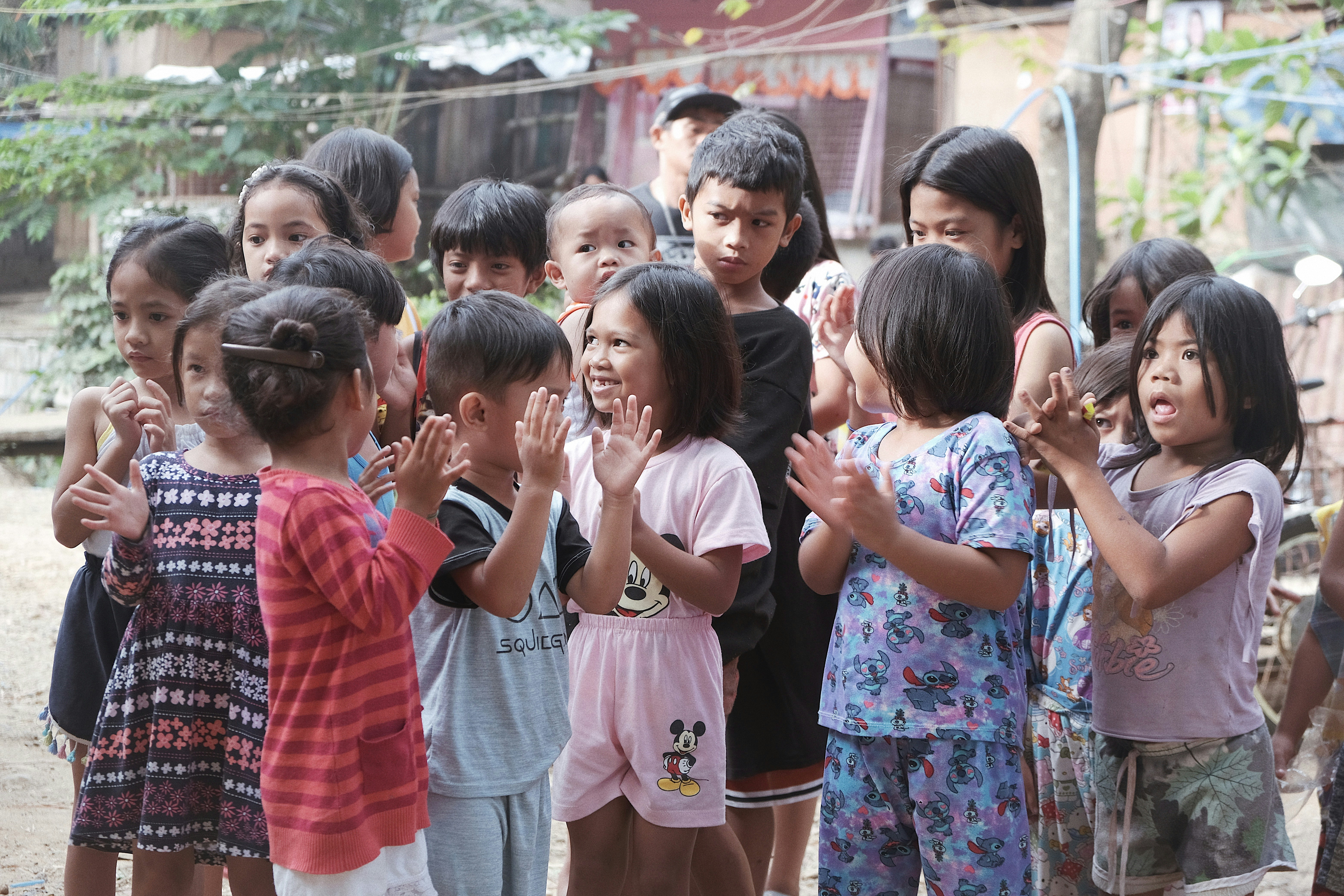 a group of young children standing next to each other