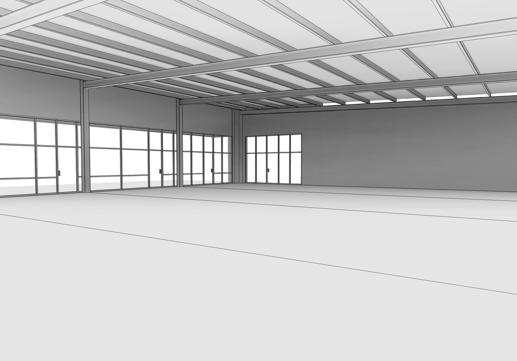 A spacious, vacant interior with large windows and high ceilings, flowing light across the open floor.