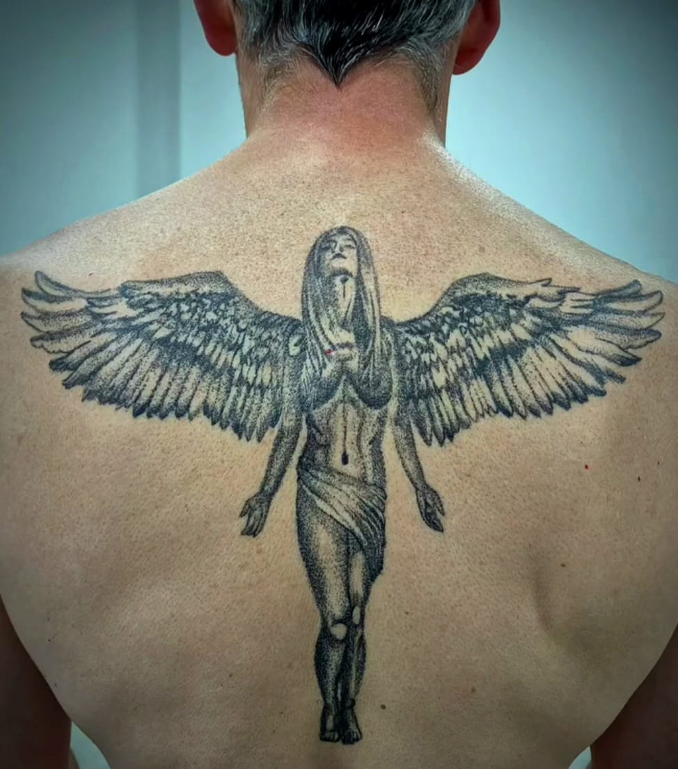 Hand tattoo with roaring gorilla in black and grey in Hazel Grove