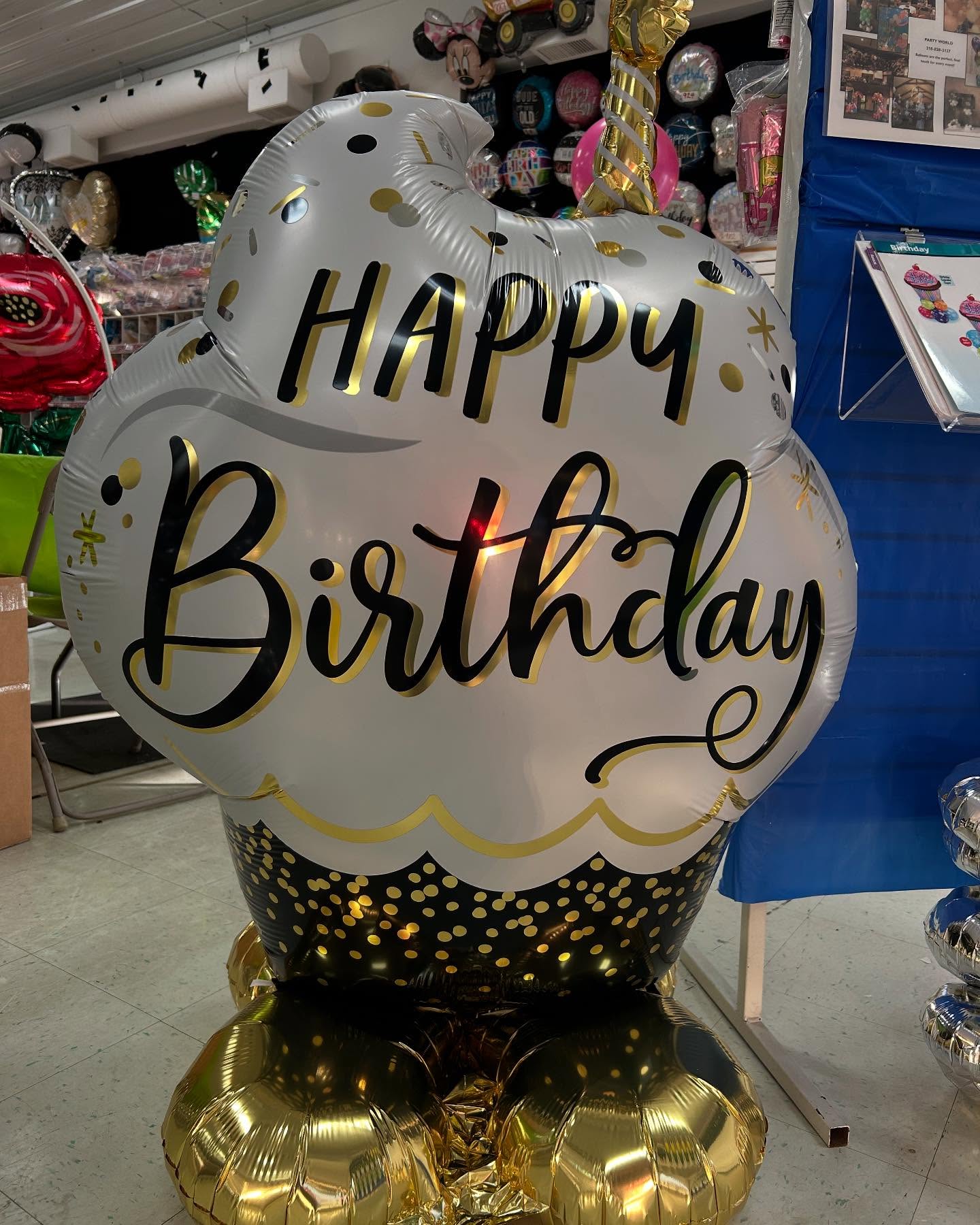 Happy Birthday balloon arrangement with colorful foil letters and festive decorations displayed by Be Bold Balloons