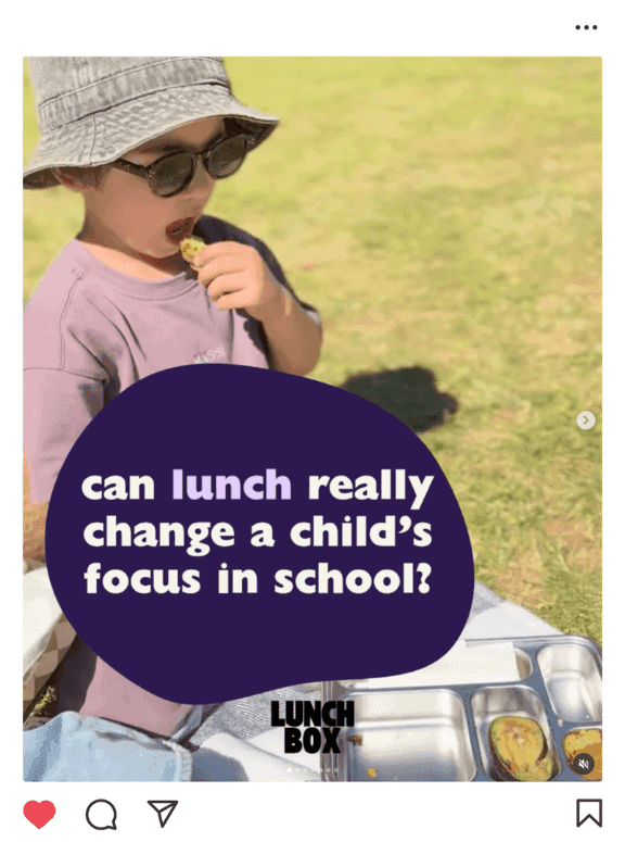 Child sitting outside eating from a lunchbox with text overlay asking “can lunch really change a child’s focus in school?”