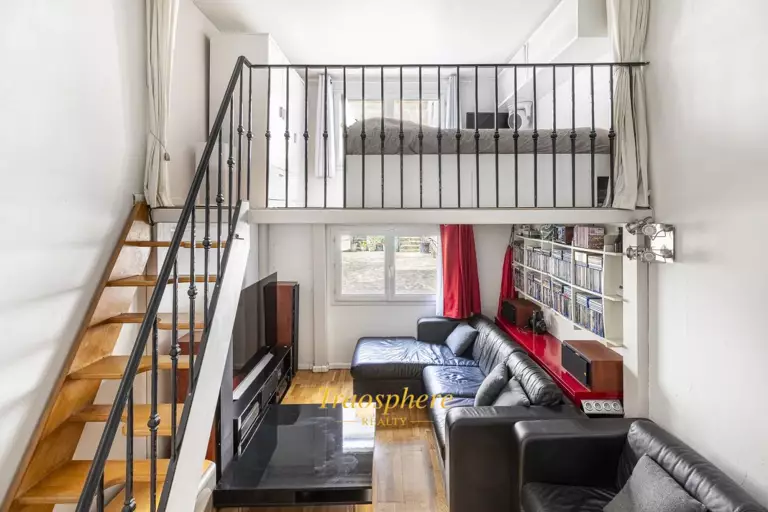 A serene backyard with a pool, sun loungers, and olive trees, set against a warm, sunny landscape.