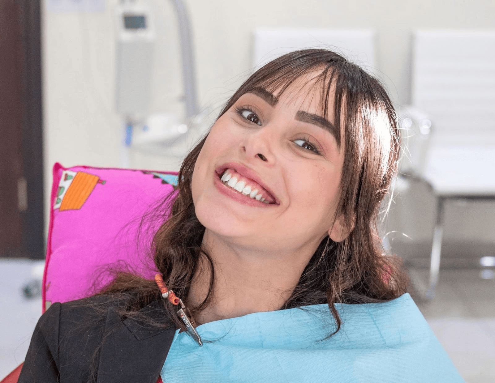 Woman smiling with bright, flawless teeth after a Hollywood Smile treatment at Bella Medical Centre.