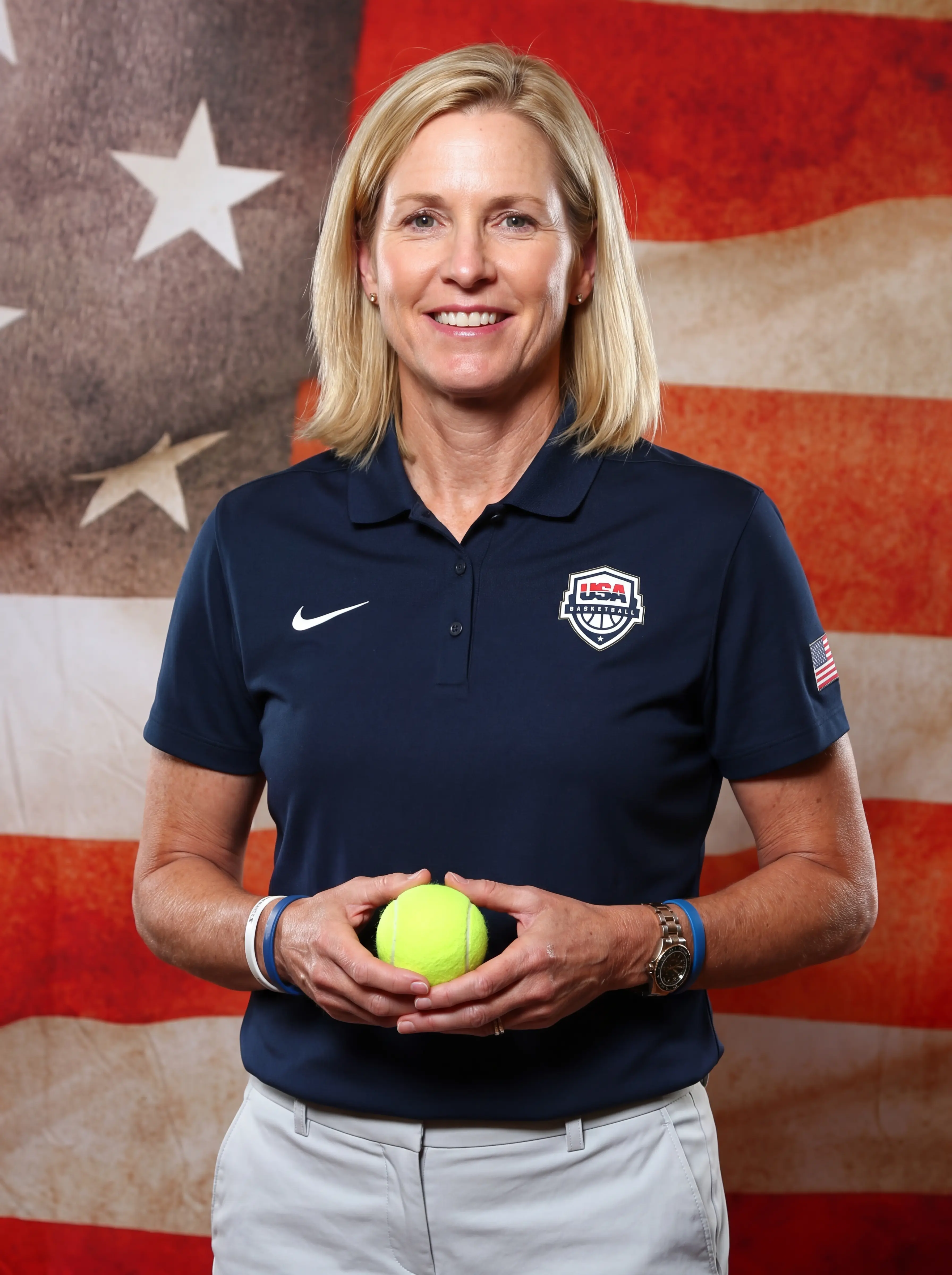 Portrait photo of a sports coach infront of USA Flag