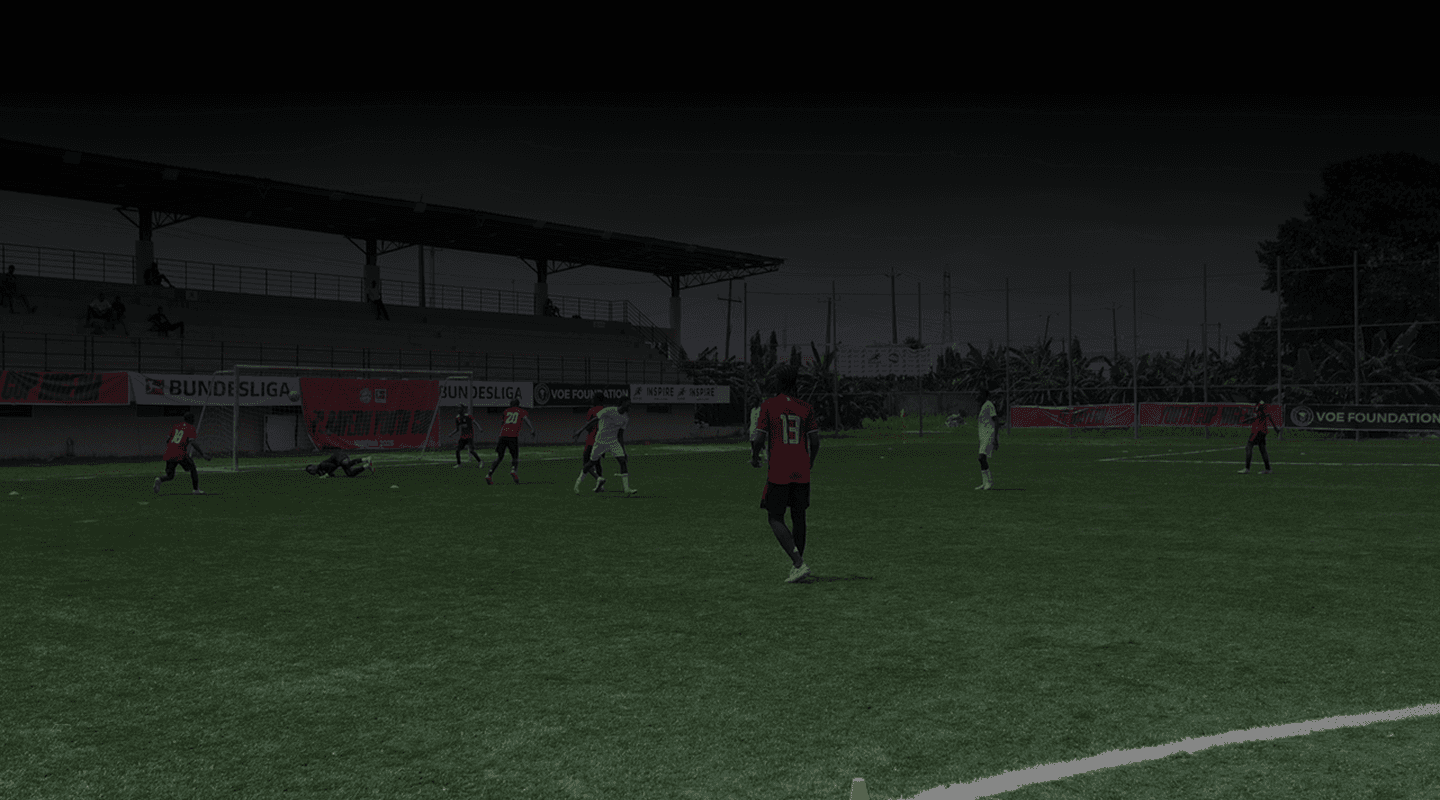 Football players on a pitch during a match