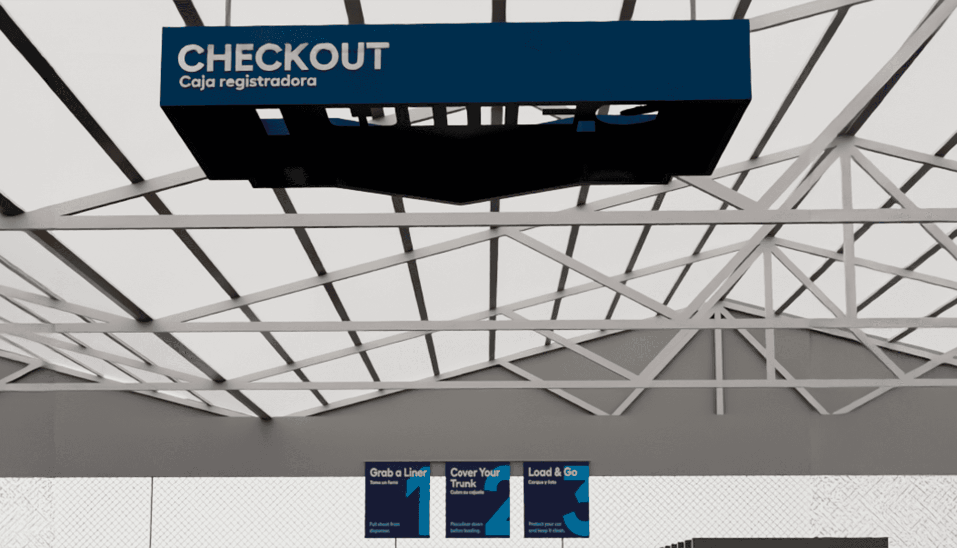 Designed as a dual-purpose wayfinding element, this overhead form reinforces Lowe’s brand presence while guiding customer flow through self-checkout and packing zones.
