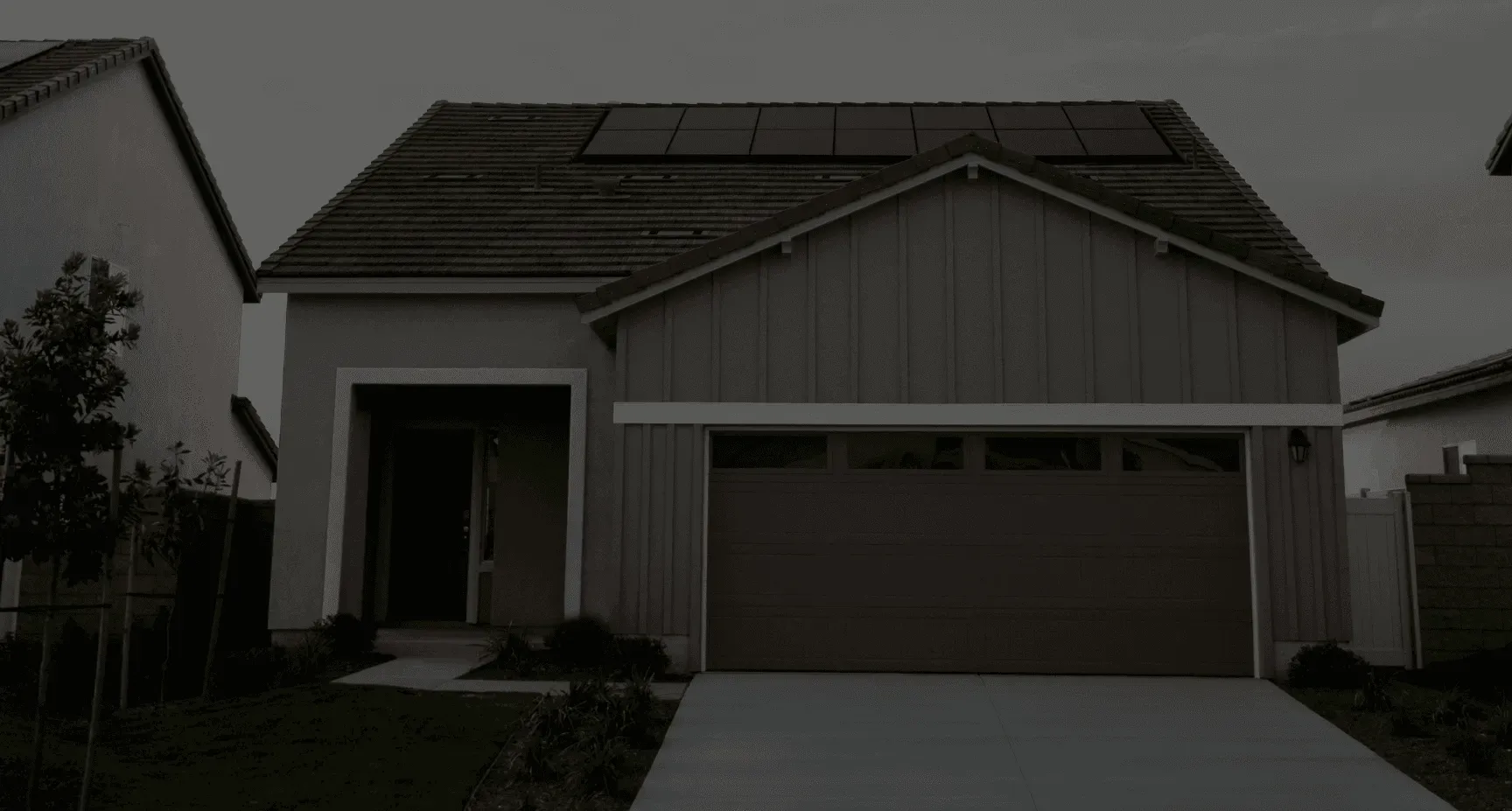 New garage door installation Rio Rancho. Modern home with solar panels.